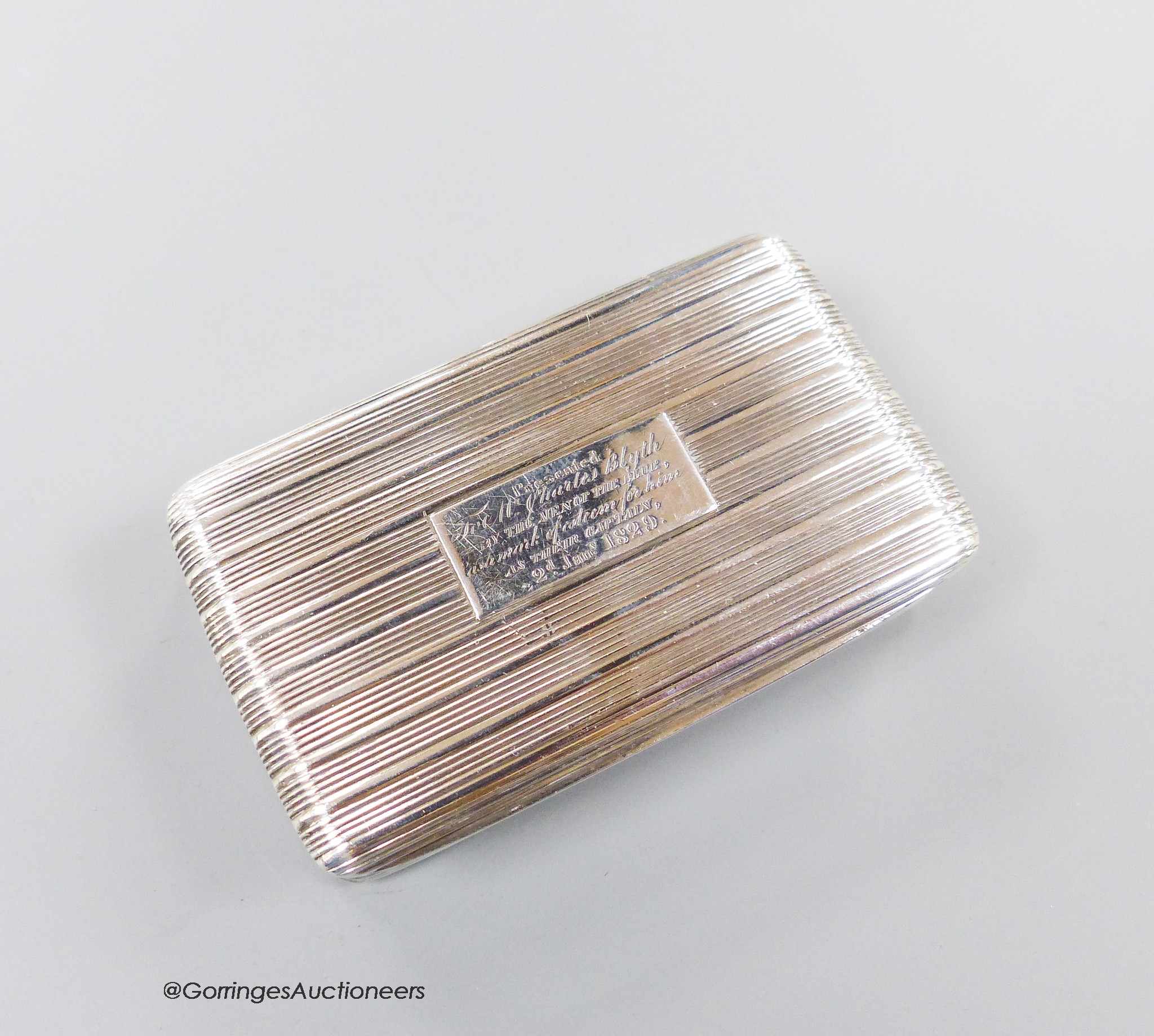 A George IV ribbed silver rectangular snuff box, with engraved inscription, Thomas Shaw, Birmingham, 1824, 71mm, 74 grams.